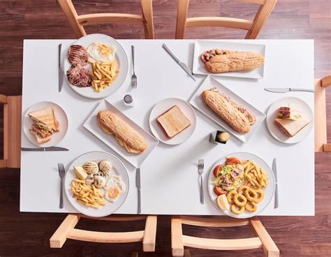 Premium Photo | Overhead shot of restaurant table with food