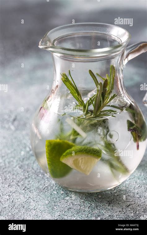 Glass jar of water with herbs Stock Photo - Alamy