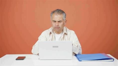 Tired man at laptop. 33540991 Stock Video at Vecteezy