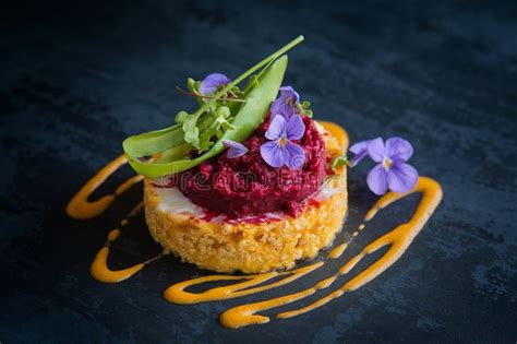 Elegant Gourmet Dish with Edible Flowers and Artistic Presentation ...