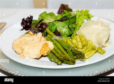 A dinner plate holds some healthy looking food at a wedding Stock Photo ...