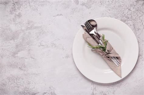 Premium Photo | Clean empty white plate with cutlery