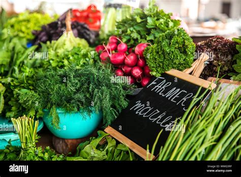 Assortment of fresh herbs on counter at farmer's market Stock Photo - Alamy