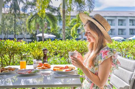 Woman Enjoying Morning Meal in Luxurious Tropical Hotel Stock Photo ...