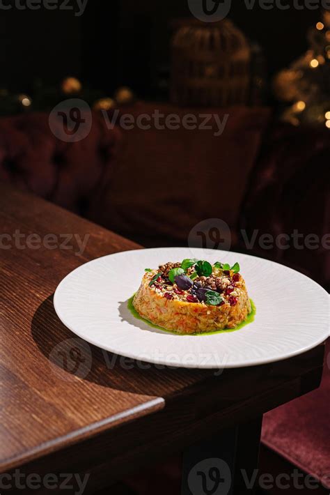 Culinary creation featuring vibrant dish on elegant plate in dimly lit ...