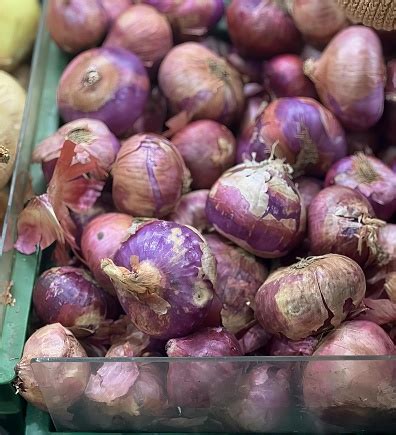A Photography Of A Bin Of Onions And Potatoes In A Market Grocery Store ...