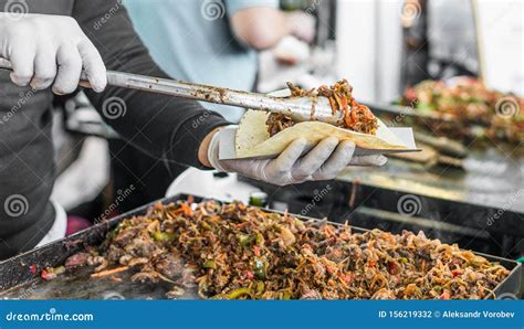Chef at a Street Food Market Preparing a Taco Stock Photo - Image of ...