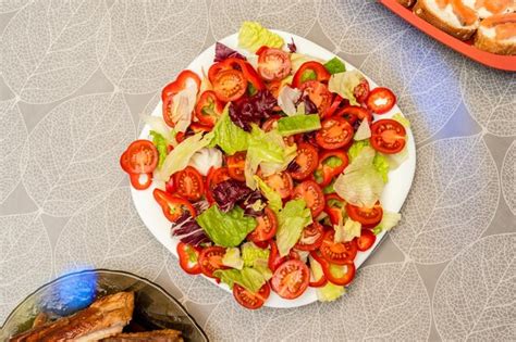 Premium Photo | Healthy colorful mix vegetables on white plate diet menu