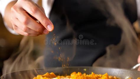 Chef Sprinkling Spice Over Steaming Cooked Dish Stock Footage - Video ...