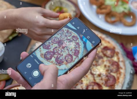 women doing Food photography with mobile Stock Photo - Alamy