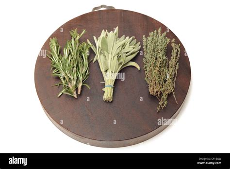 Fresh herbs on a kitchen chopping board Stock Photo - Alamy