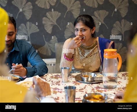 Family eating traditional Indian food at home Stock Photo - Alamy