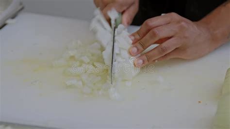Closeup Footage of the Hands of a Chef Dicing an Onion with Sharp Knife ...