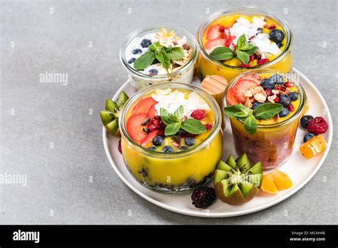 Serving tray with layered food in jars Stock Photo - Alamy