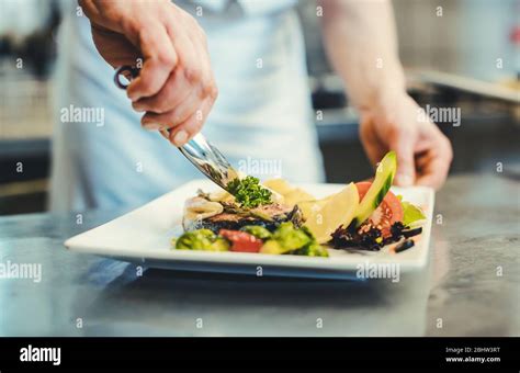 Garnishing fish hi-res stock photography and images - Alamy