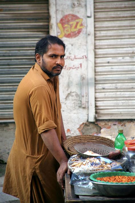 Street Vendor Preparing Fresh Food by Side of Road · Free Stock Photo