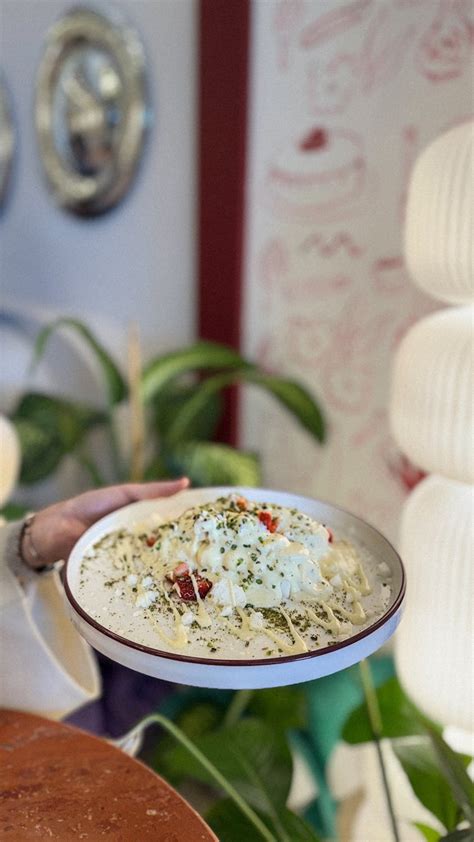 Gourmet Pasta Dish with Creamy Sauce in Cozy Setting · Free Stock Photo