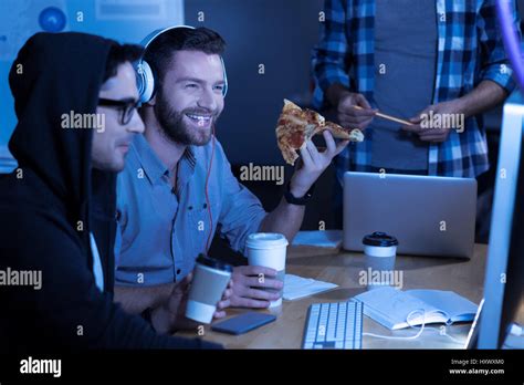 Happy joyful man enjoying his meal Stock Photo - Alamy