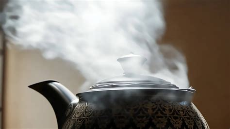 Steaming Antique Teapot in Warm Light. 47658515 Stock Video at Vecteezy