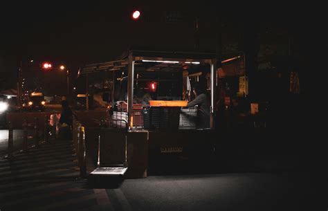 Street Food Stall next to Restaurant at Night · Free Stock Photo
