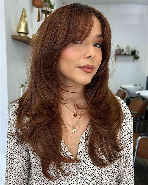 33+ layered haircut with wispy bangs