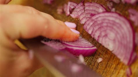 Vertical Shot of a Woman Cutting an Red Onion into Small Pieces. Stock ...