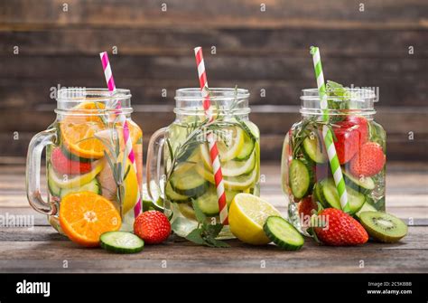 Fresh detox water with fresh fruits, vegetables and herbs in the glass ...