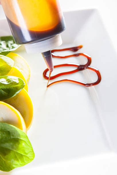 Drizzling Sauce On Food Stock Photos, Pictures &amp; Royalty-Free Images ...