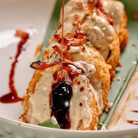 Premium Photo | A plate of food with a sauce drizzled on top of it.