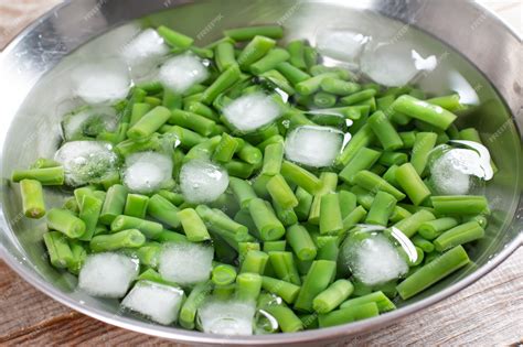 Premium Photo | Green beans in a colander. boiled or blanched ...