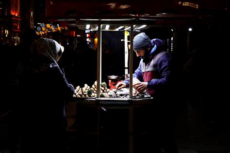 Street Food Stall next to Restaurant at Night · Free Stock Photo