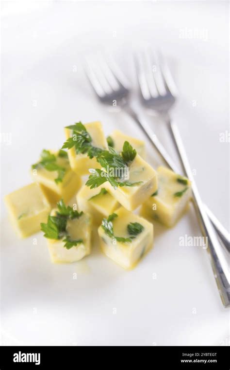 Frozen cubes of extra virgin olive oil flavored with parsley Stock ...