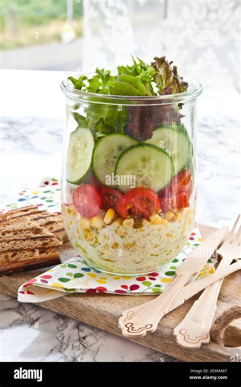 Layered salad in a jar Stock Photo - Alamy