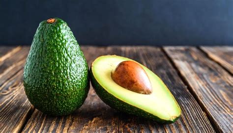 Premium Photo | Avocado on wooden background