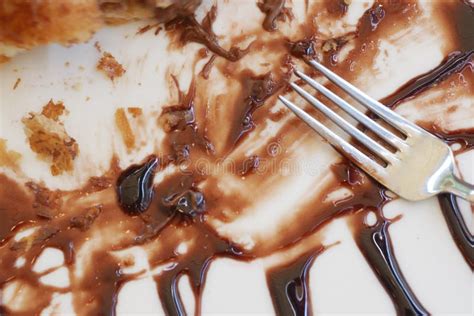 Smeared Chocolate Sauce Creatively Spread on a Plate with a Fork for an ...