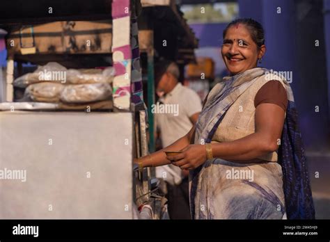 Portrait of a smiling female vendor at her roadside food stall Stock ...