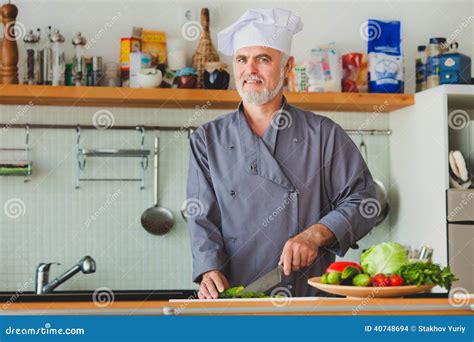 Friendly Chef Preparing Vegetables in His Kitchen Stock Photo - Image ...