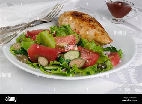 Easy garnish of fresh vegetables with chicken schnitzel Stock Photo - Alamy