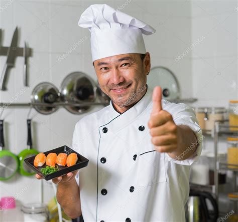 Asian chef on kitchen Stock Photo by ©upslim 105278962