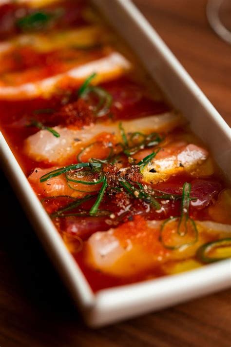 Gourmet Sashimi Dish with Vibrant Garnishes. Stock Photo - Image of ...