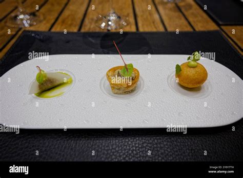 Gourmet plated appetizers served on a modern white dish Stock Photo - Alamy