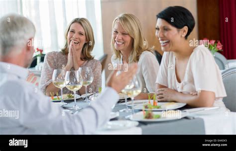 People enjoying meal in restaurant Stock Photo - Alamy