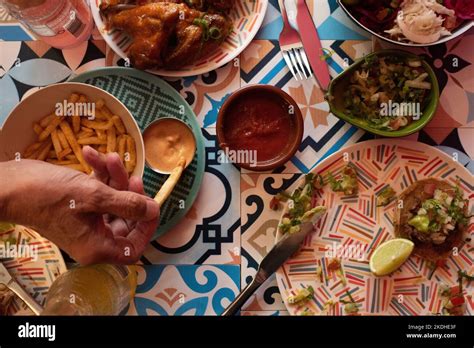 people eating authentic Mexican food at a party Stock Photo - Alamy