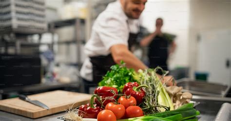 Fresh ripe vegetables prepared for cutting in commercial kitchen. photo ...