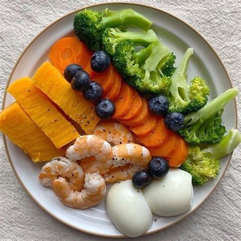 Healthy Dinner Plate with Broccoli, Carrots, Blueberries, and Shrimp