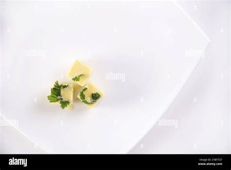 Frozen cubes of extra virgin olive oil flavored with parsley Stock ...