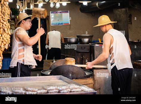 Preparation of a street food snacks in Xian Stock Photo - Alamy