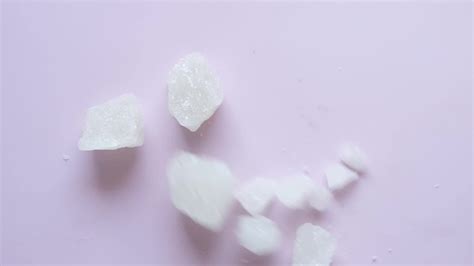 Salt crystals on table 15808047 Stock Video at Vecteezy