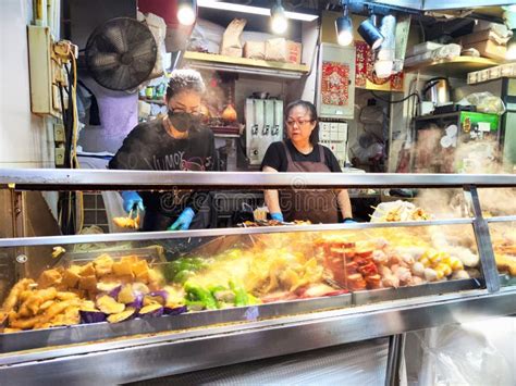 Hong Kong - April 05, 2024: Street Food Vendors Preparing and Serving ...