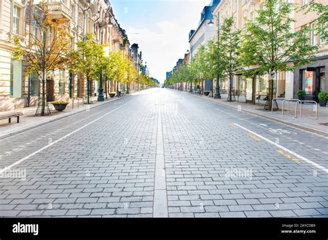 City street with empty road Stock Photo - Alamy